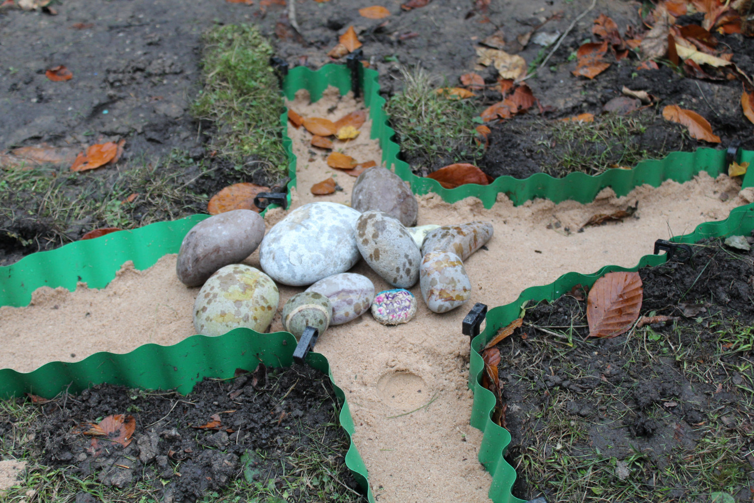 Photo of the unfilled pebble cross at All Saints